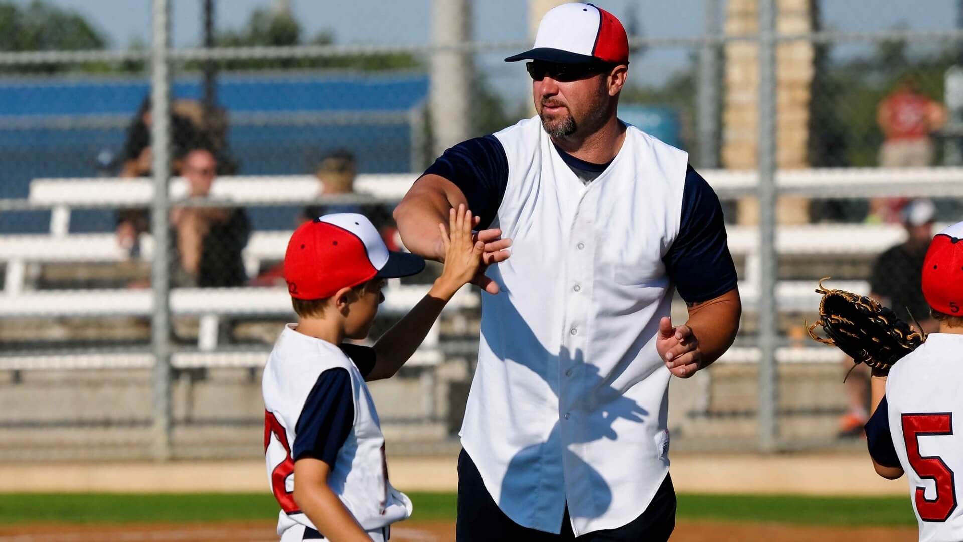 a little league coach with a player
