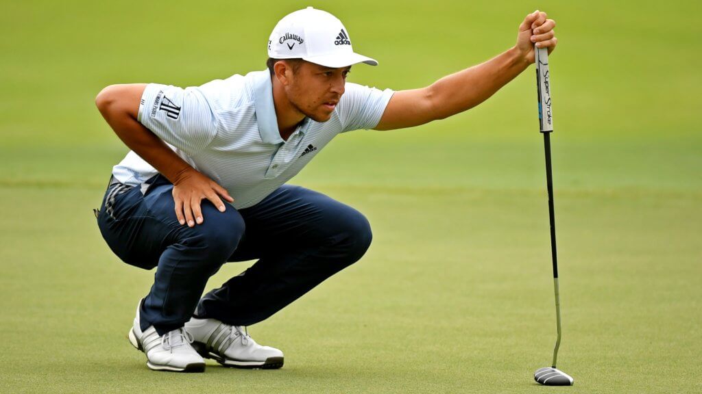 Xander Schauffele lines up his putt on the 18th green during the final round of the Tour Championship golf tournament at East Lake Golf Club. | Porsche European Open